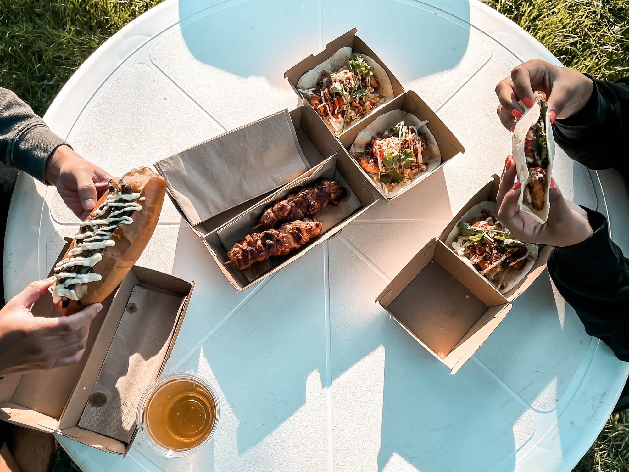 Food items, Chicken Skewers, Prawn Tacos and Chorizo Hot Dog